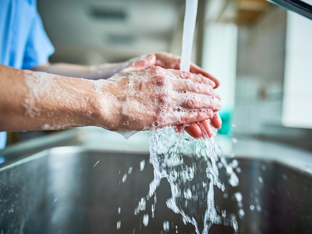 Physician washing their hands.